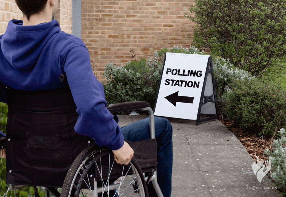 Person in a wheelchair facing a polling station sign, highlighting barriers to voting for disabled individuals.